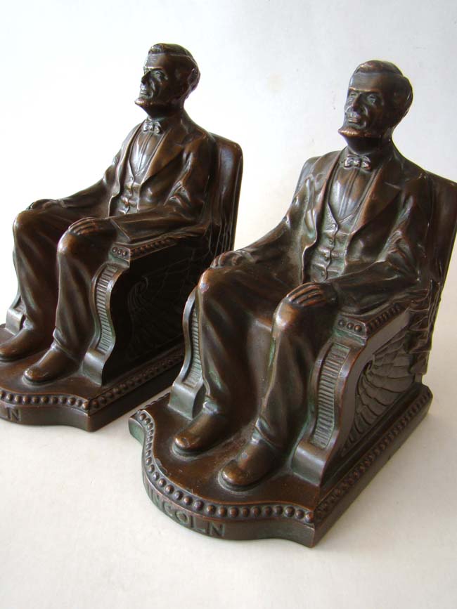 A pair of Lincoln in the chair bookends by NUART circa 1924